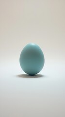 Fototapeta premium Pale blue sphere on white background, studio shot, minimal design, website banner