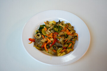 Spicy salad with mushrooms, arugula and sesame. Vegan dish. The top view
