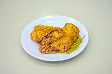 Lavash zurna doner kebab ( zurna  durum )  or shawarma sliced in plate isolated.  hatay usulu tavuk Et doner durum. Gobit ekmek arasi doner. Pilavustu iskender doner kebap. 