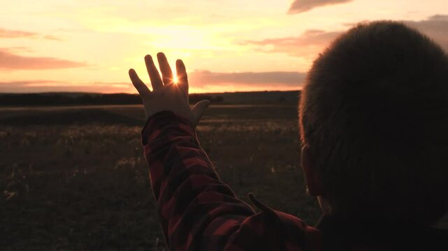sign hand finger sunset gesture, boy child son kid sun, childish happiness journey sky, bright child hand light ray, summer nature seasonal travel, silhouette hand sun boy, son's hand pulls sun nature