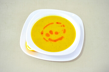 Lentil ( mercimek corbasi ) soup with melted butter and red pepper sauce. Limon ve soslu mercimek corba.