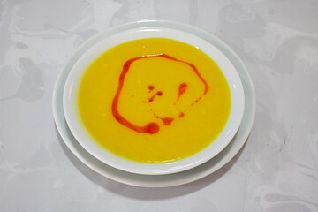 Lentil ( mercimek corbasi ) soup with melted butter and red pepper sauce. Limon ve soslu mercimek corba.