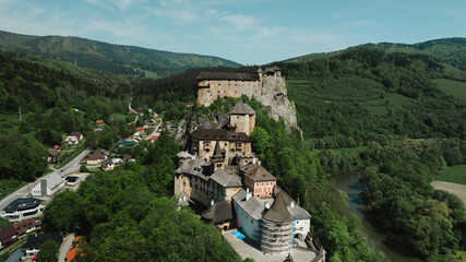 Obraz premium Orava castle - Oravsky Hrad in Oravsky Podzamok in Slovakia. Medieval stronghold on extremely high and steep cliff by the Orava river.
