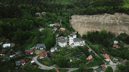 Beautiful aerial countryside landscape in Spania Dolina village, Slovakia. Old mining village. Historic church in Spania dolina. Summer rural lanscape in Slovakian mountains. © Robbie Smith 1 