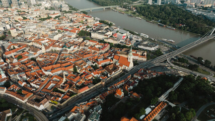 Naklejka premium Bratislava old town view castle and city church in city centre. bratislavy skyline aerial view drone footage of bratislava slovakia city.