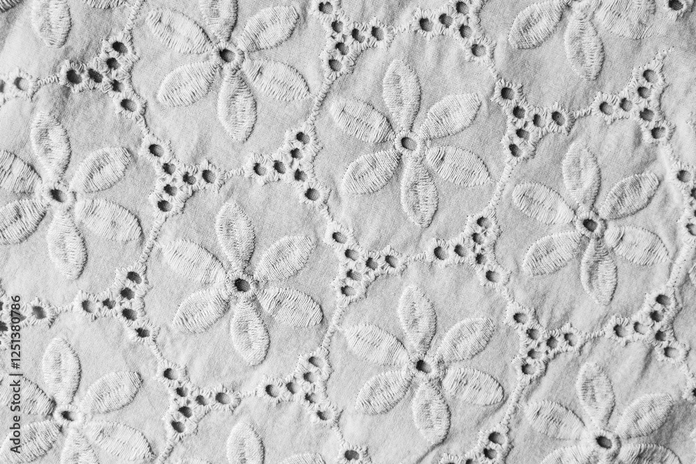 Wall mural black and white floral background. texture of gray fabric with floral embroidered ornament.