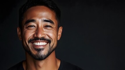 Close up portrait of a smiling Asian man with a friendly and welcoming expression conveying a positive confident and inviting mood