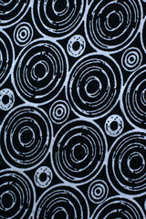 black background with white circles. texture of black fabric with geometric patterns.