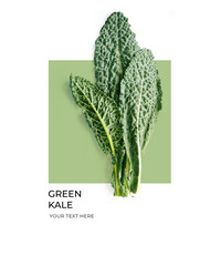 Creative layout made of green kale on the green and white background. Flat lay. Food concept. Lemon on white background.