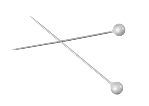 Two crossed metal pins with round heads on white background