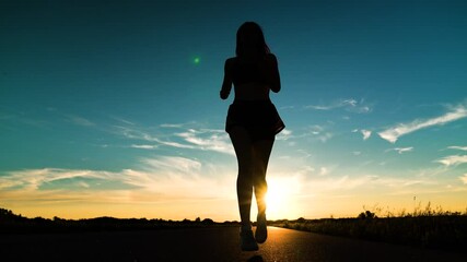 silhouette sports girl running legs along road sunset, jogging, sports morning dawn, focused female athlete, running, athletics fitness, running athlete, preparing races, triathlon exercise, running