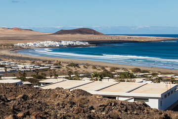 Playa De Famara Beach/An image showing Playa De Farmara surfing beach shot in Lanzarote, Canary Islands, Spain