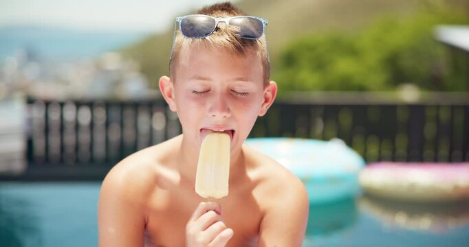 Eating, ice cream or face of kid by pool for summer, holiday or travel in hotel for outdoor tourism. Relax, portrait or boy child tasting vanilla sucker, popsicle or frozen snack on weekend vacation