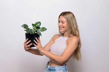 Nature love: Blond girl and plant