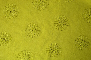 bright yellow floral background. texture of yellow fabric with floral embroidered ornament.