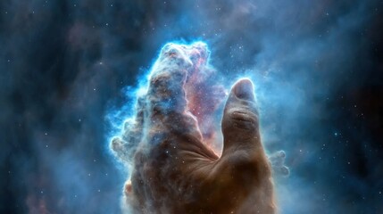 Fototapeta premium A hand is shown in the sky with a cloud of gas and dust surrounding it