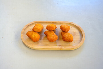 Homemade fried chicken nuggets isolated on white background. Chicken nugget. Citir tavuk. Citir, tavuk atistirma  tabagi.