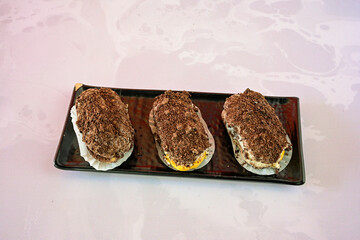 Ekler Pasta Turkish delicious ekler pasta with plate. Klasik, cikolatali, muzlu, frambuazli, karamelli, cilekli, oreolu ekler.