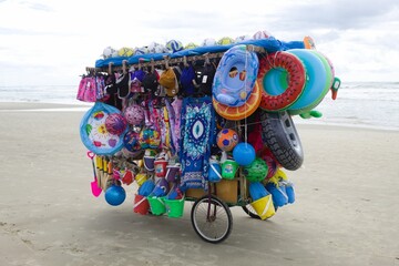 Street vendor on a beach in Brazil with various products