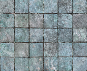Unique natural stone marble tiles wall texture in mix of blue, grey, cyan color with random abstract veins. Honed and rough outdoor marble tiles wall seamless background.