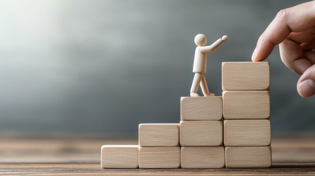 A miniature figure climbs wooden blocks, symbolizing progress and support in personal or professional development.