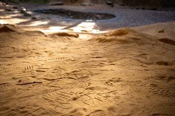 sandy footprints on cave floor