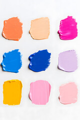Pastel oil paint swatches with pale pink, blue, blue marine colors isolated on white backdrop

