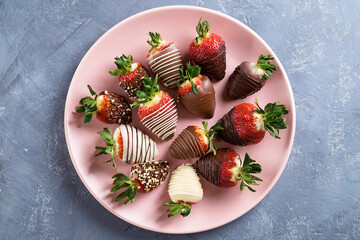 Generated image - Delicious chocolate covered strawberries on pink plate, top view