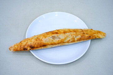 Kiymali pide.Turkish pide with minced meat. Turkish pizza mince pita Pide on white . Etli ekmek.Kusbasi kasarli, kiymali kasarli, kiymali yumurtali, Bafra, Trabzon, Kusbasili pide. Urfa acili lahmacun