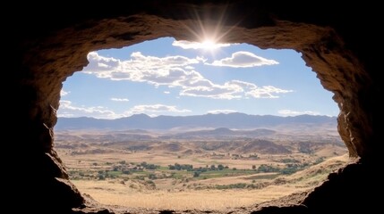 Cave View Of Valley On Sunny Day With Mountains Blue Sky And Sun Burst Landscape Outdoors.