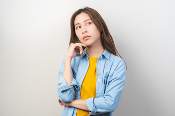 Thinking with problem, frustrated asian young woman, girl expression face thoughtful, brunette hair wearing casual t-shirt, gesture strain emotion, looking away standing isolated on white background.