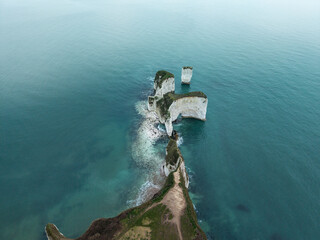 Beautiful aerial drone atmospheric dramatic landscape of cliffs on Jurassic Coast ni England during foggy Winter morning