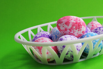 Colorful Easter Eggs with Spots in Plastic Basket