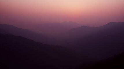 Obraz premium Mountain Range Silhouette at Dusk with Soft Purple Hues
