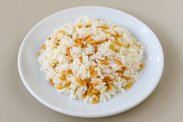 Traditional delicious Turkish food; Turkish style rice pilaf (Turkish name; Arpa sehriyeli. tavuk, kuru fasulyeli, pirinc pilavi). Cigerli, kavurmali, tereyagli nohut pilav.
