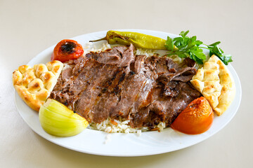 Lavash zurna doner kebab ( zurna  durum )  or shawarma sliced in plate isolated.  hatay usulu tavuk Et doner durum. Gobit ekmek arasi doner. Pilavustu iskender doner kebap. 