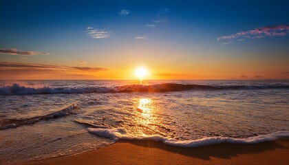 Fototapeta premium ocean sunrise over beach shore and waves the sun is rising up over sea horizon