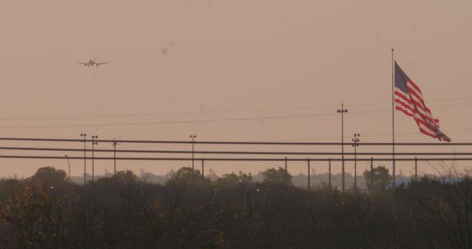 American Flag with Airline Plane Flying By