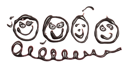 Chocolate topping in shape round abstract comic faces, melted, isolated on white