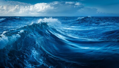 Ocean Waves Crashing: A mesmerizing view of powerful ocean waves crashing against the deep blue water, creating a symphony of white foam and glistening sunlight.