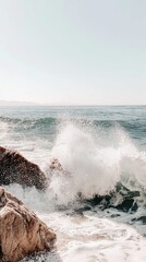 Fototapeta premium Coastal waves crashing on rocks, tranquil ocean scene