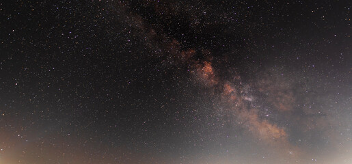 Beautiful bright Milky Way on the starry sky. Night ladscape.