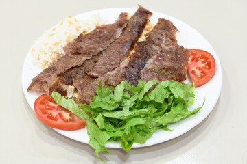 Lavash zurna doner kebab ( zurna  durum )  or shawarma sliced in plate isolated.  hatay usulu tavuk Et doner durum. Gobit ekmek arasi doner. Pilavustu iskender doner kebap. 