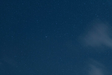 Beautiful starry night  sky with clouds. Astronomical background. 