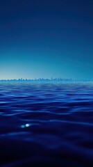 Obraz premium Distant city skyline viewed across dark rippling water surface
