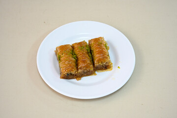 Turkish Dessert Sobiyet, havuc dilimi, midye baklava, mussels baklava and classic baklava with Pistachio . Cikoltali cevizli, fistikli soguk Baklava, top view.