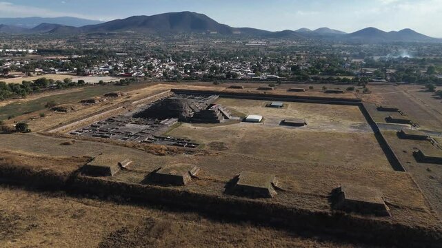 Citadel and Temple of Quetzalcoatl at the archaeological site of Teotihuacan, Mexico. Aerial camera slowly approaching