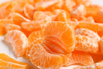 Texture of sweet peeled mandarins, closeup
