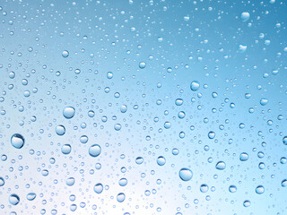 Close-up of water droplets on glass, capturing the cool, fresh, and glistening essence of moisture.