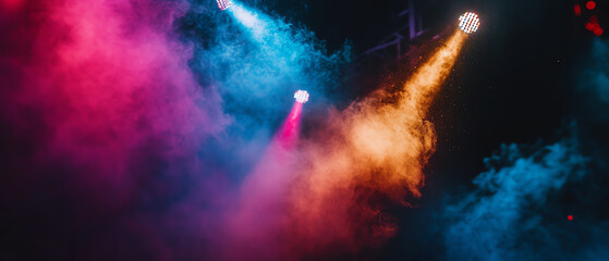 Vibrant stage lights illuminate a cloud of colored smoke, creating a dynamic atmosphere perfect for concerts and performances